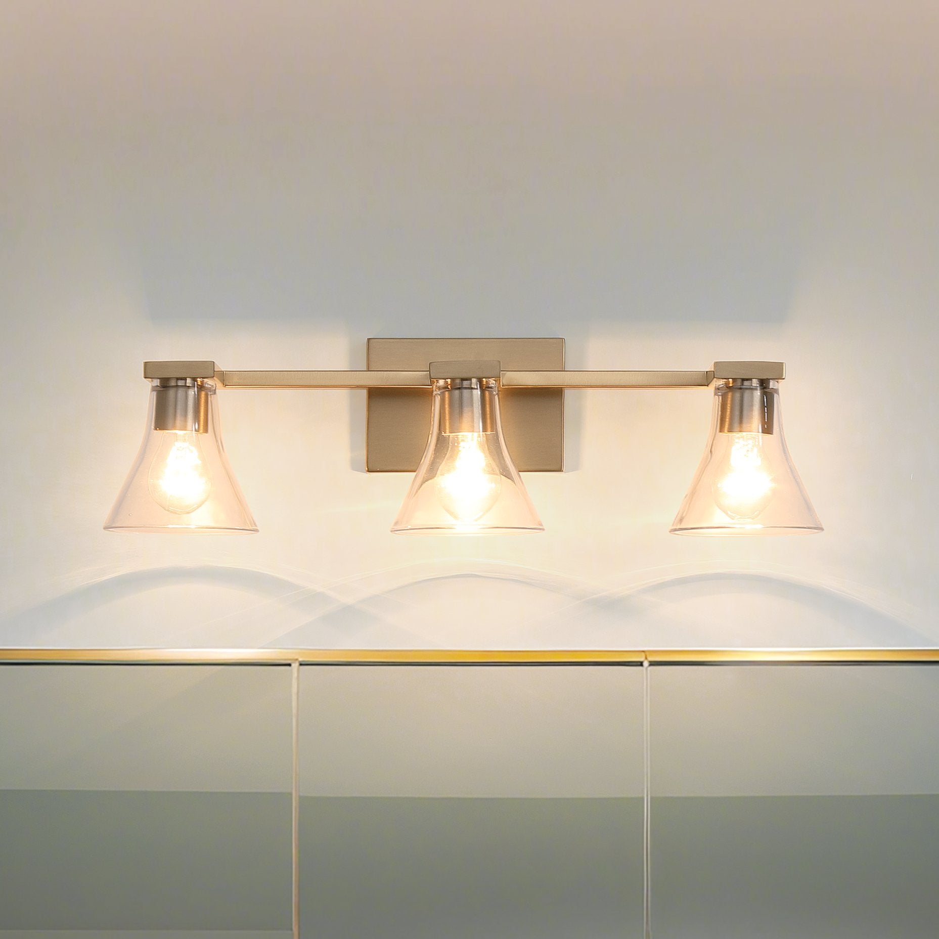 Gilford 24-inch 3-light Champagne Gold Vanity Light with Clear Glass Shades