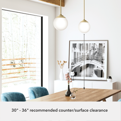 Hepburn 8-inch 1-light Modern Brass Globe Pendant with Cased White Glass
