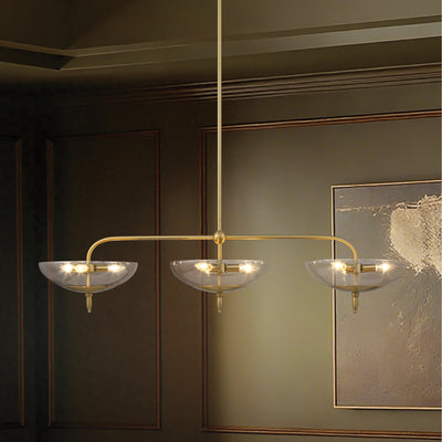 Fiorello 54-inch 9-light Brushed Gold Linear Chandelier with Smoked Amber Glass Shades