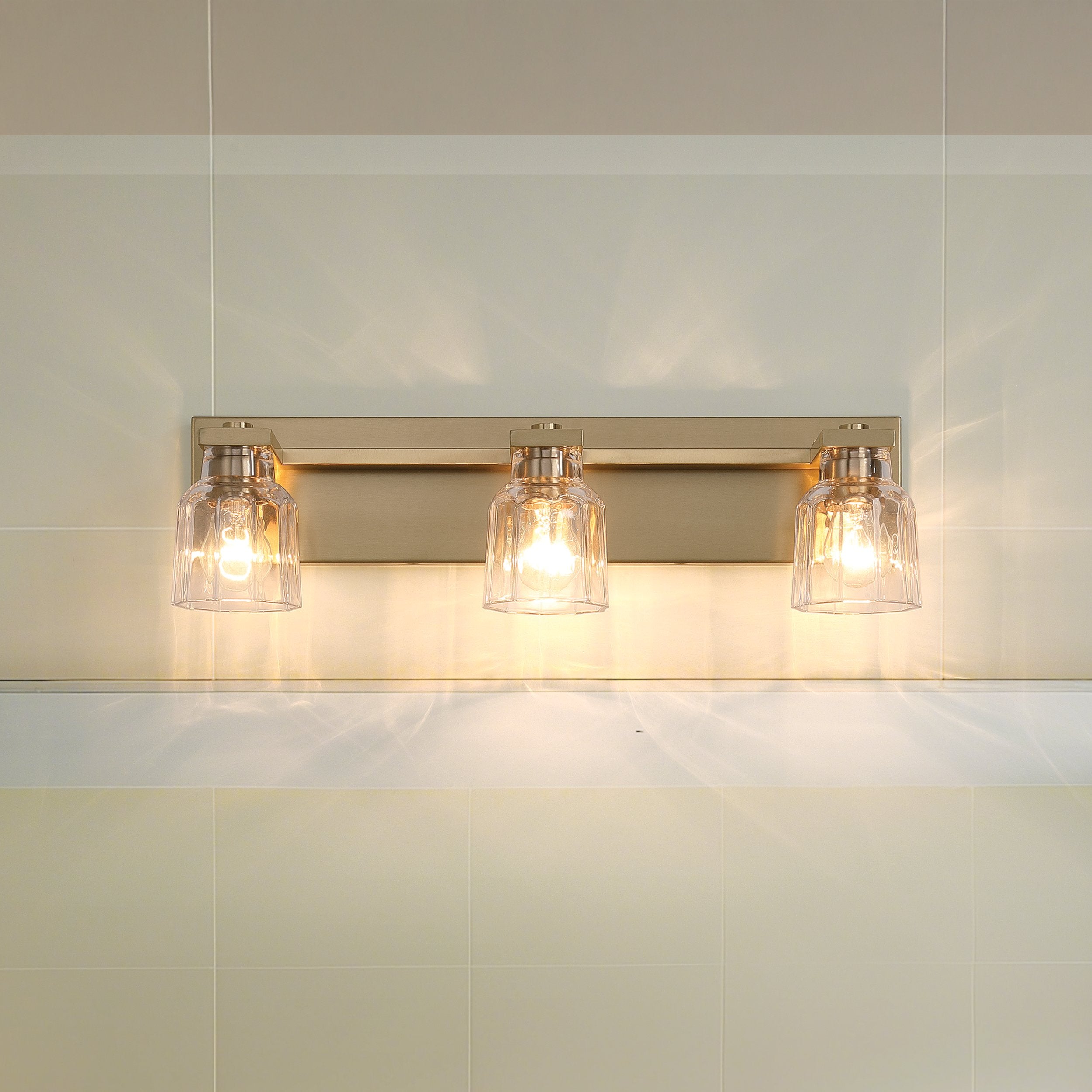 Dryden 24-inch 3-light Champagne Gold Vanity Light with Clear Ribbed Glass Shades