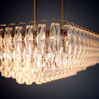Prism 54-inch 19-light Aged Brass Dimmable Linear Chandelier with Amber Glass