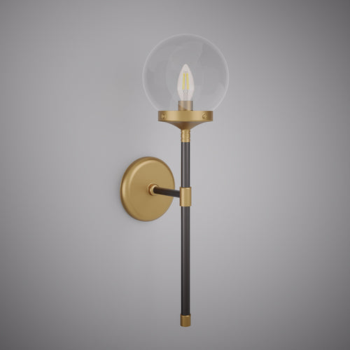 Matte black and aged brass cylindrical wall sconce with clear glass