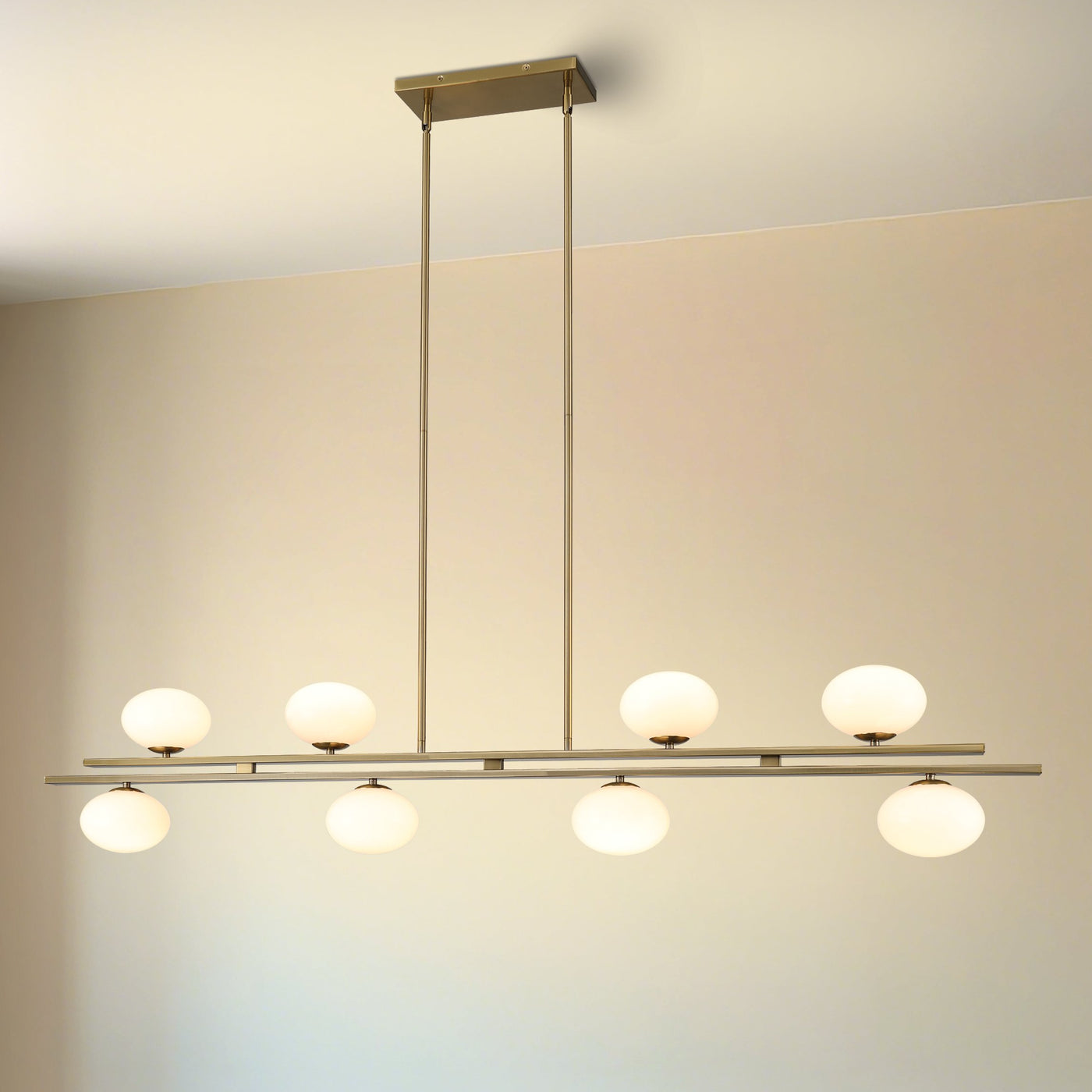 Julep 64-inch 8-light Brushed Gold Linear Chandelier with Opal Glass Shades