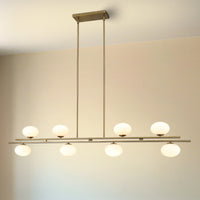 Julep 64-inch 8-light Brushed Gold Linear Chandelier with Opal Glass Shades