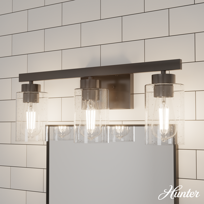 Hartland 22-inch 3-light Noble Bronze Vanity Light with Seeded Glass